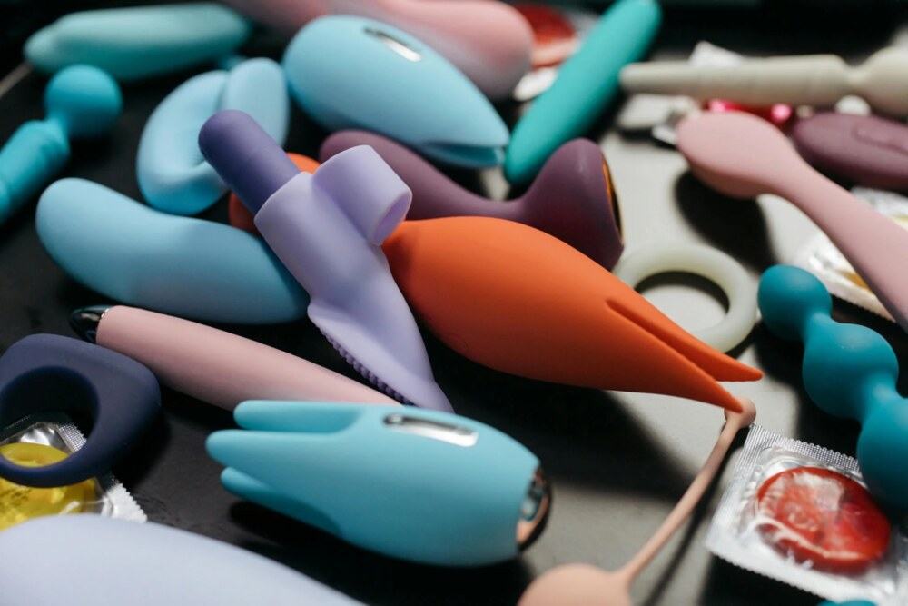Collection of colorful sex toys and condoms